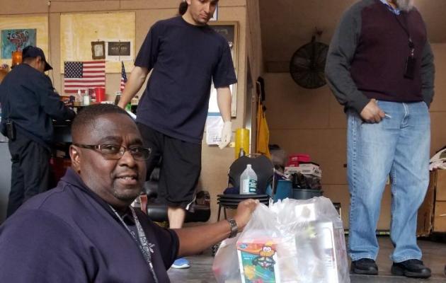 Staff handling toy donations to LA Mission