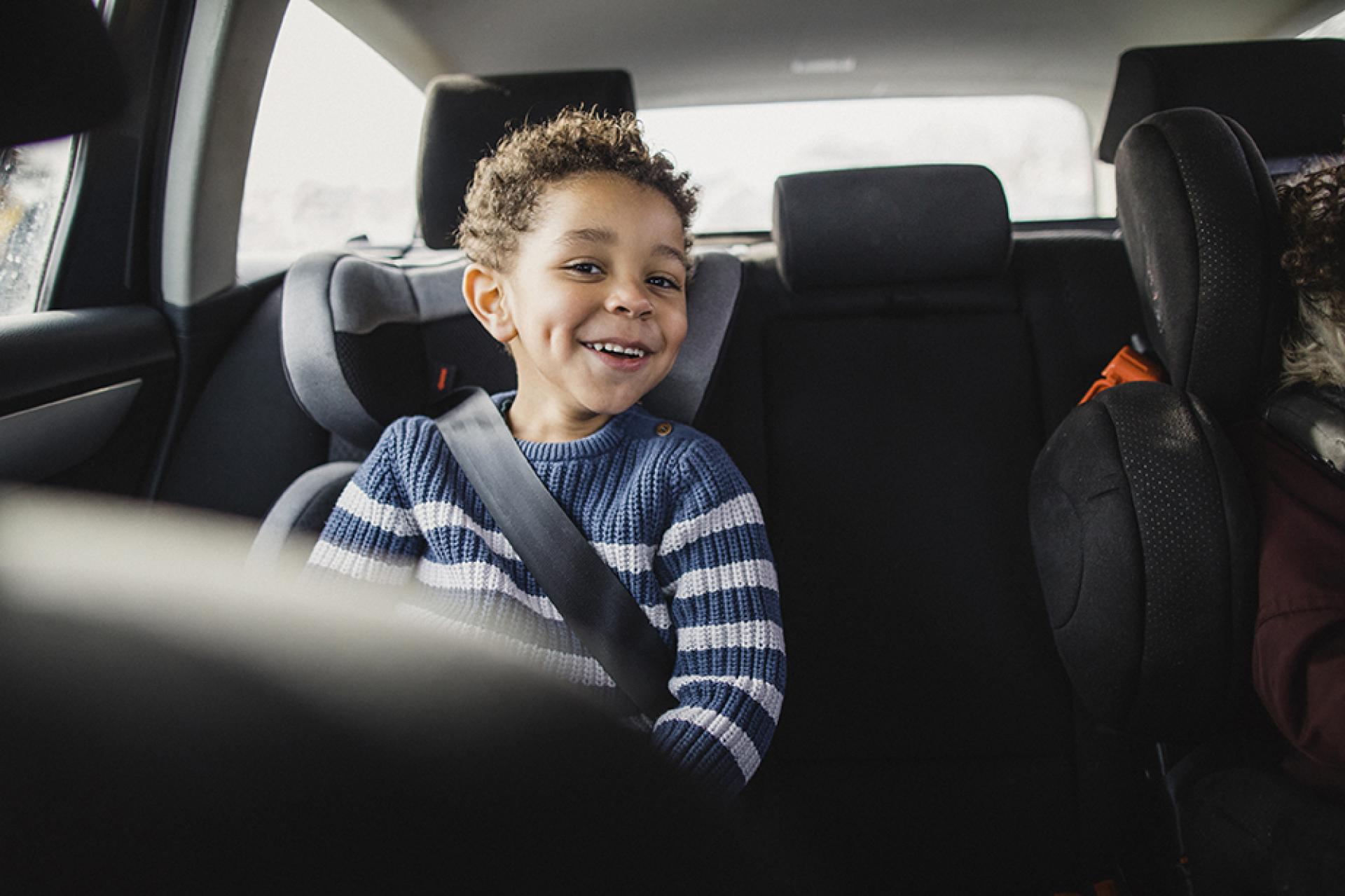 Child in car seat in a car