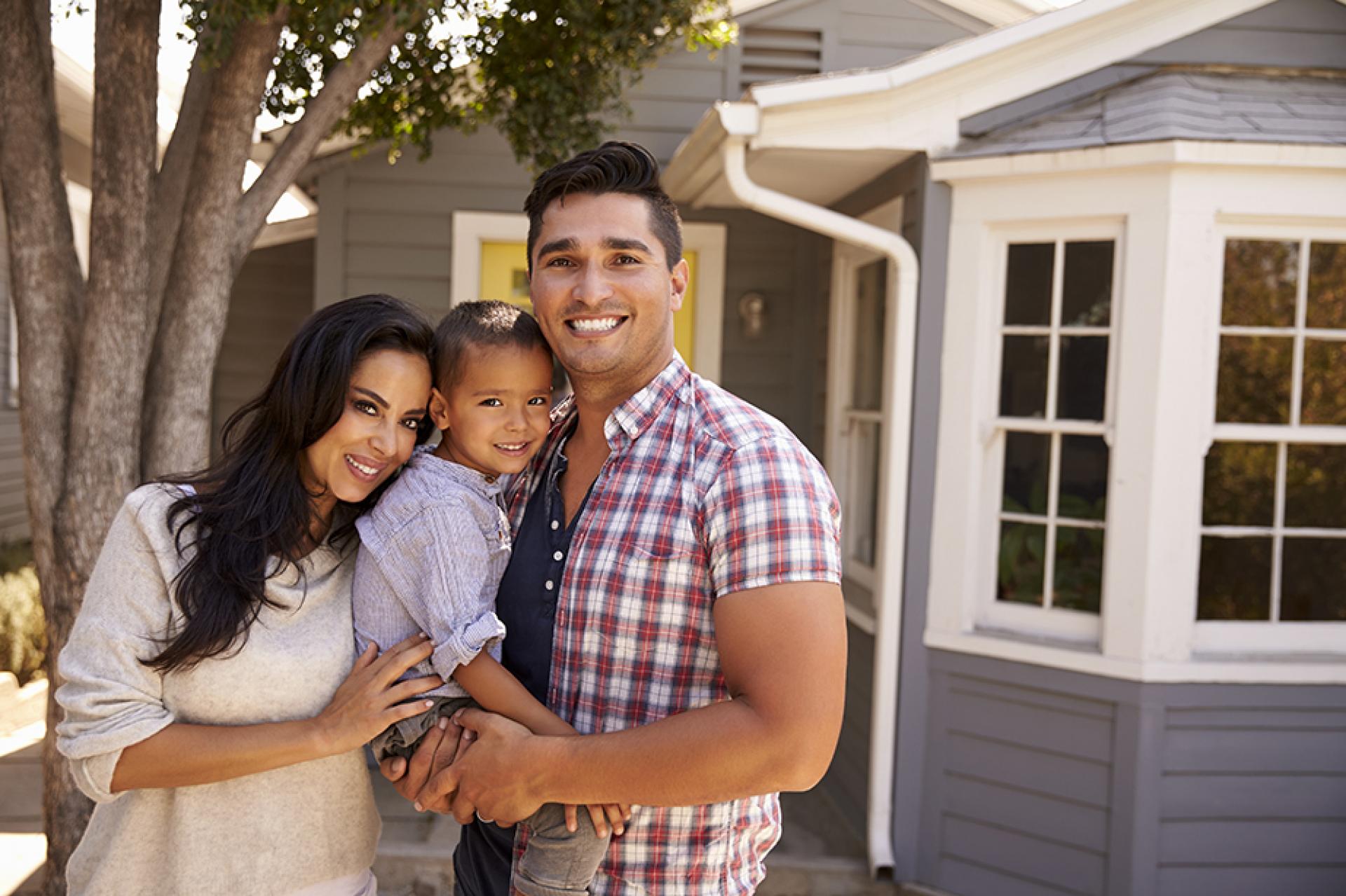 Family in front of home