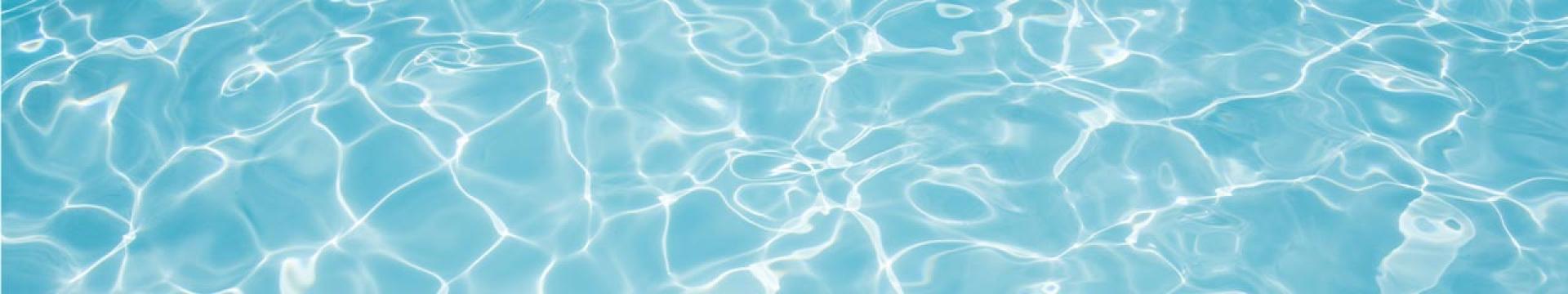 A photo of the water surface in a swimming pool.
