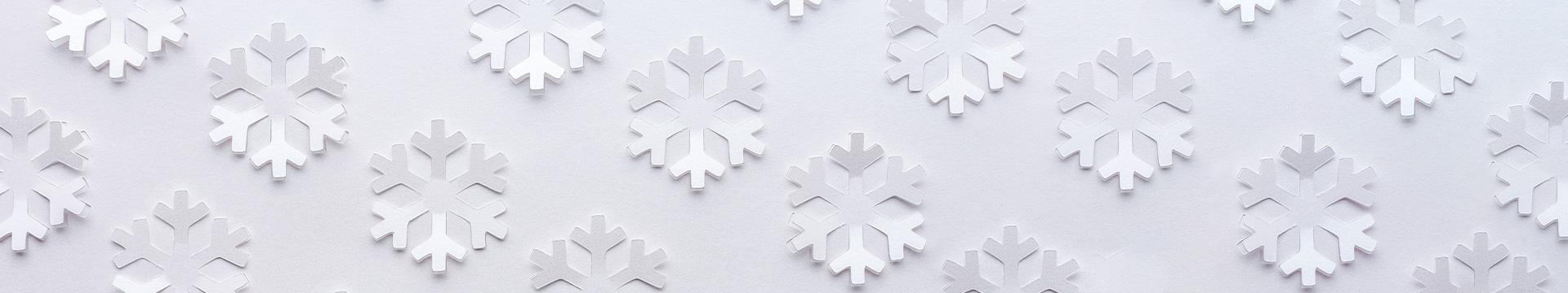 A photo of snowflakes made out of paper.
