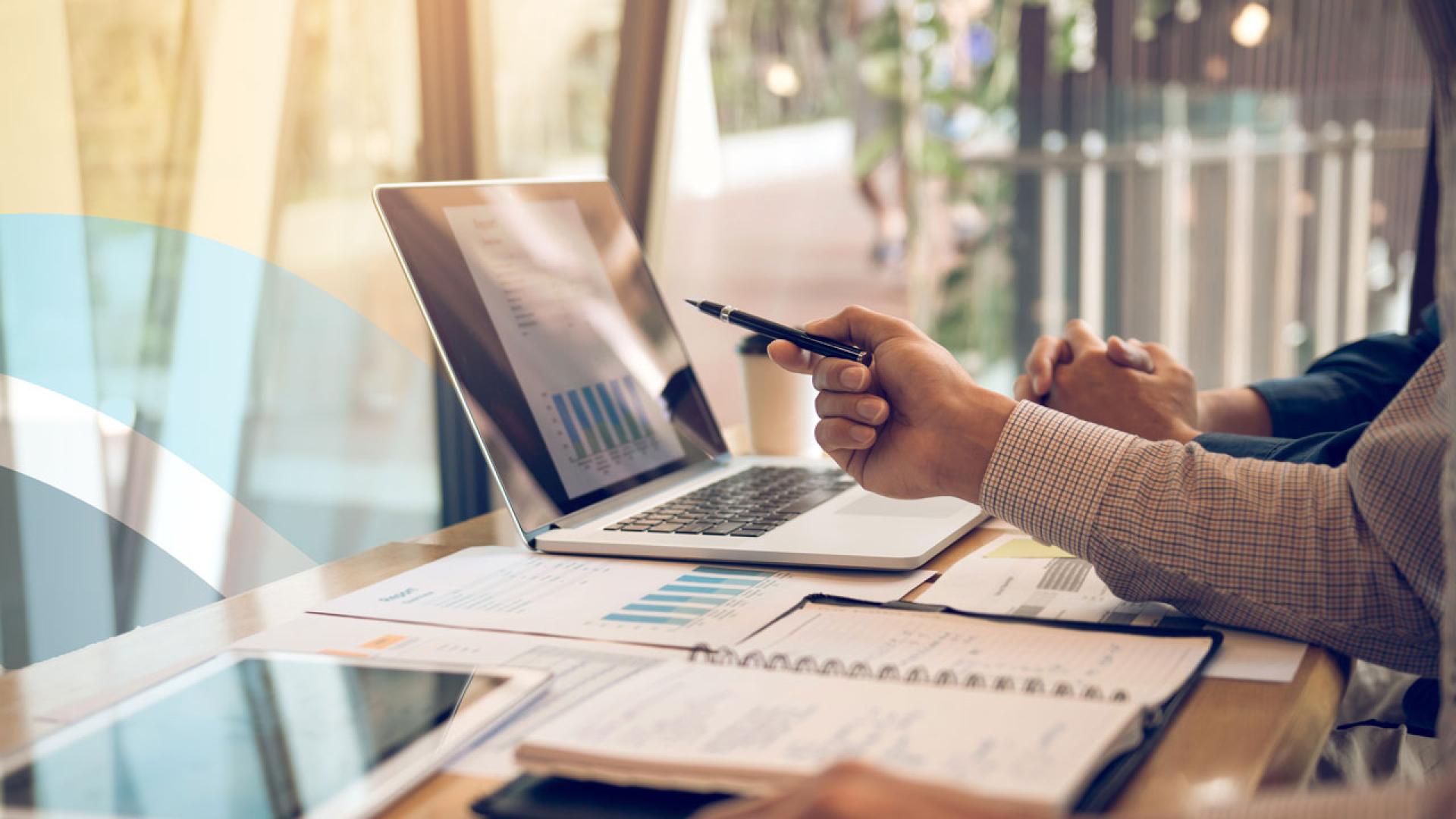 Two people reviewing a report. 