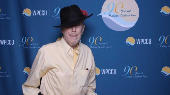 A person taking a picture in a photobooth