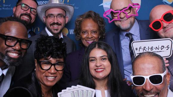 People taking a picture in a photobooth