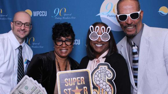 People taking a picture in a photobooth