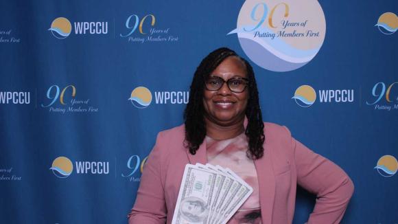 A person taking a picture in a photobooth