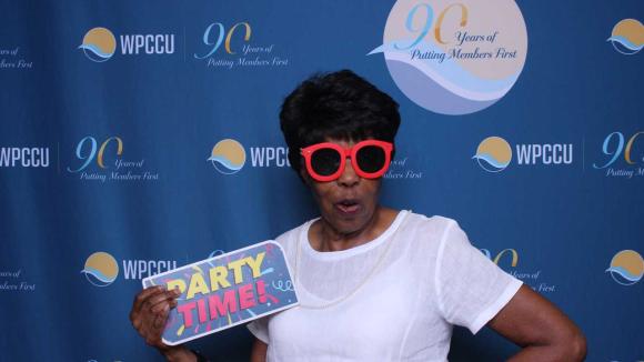 A person taking a picture in a photobooth