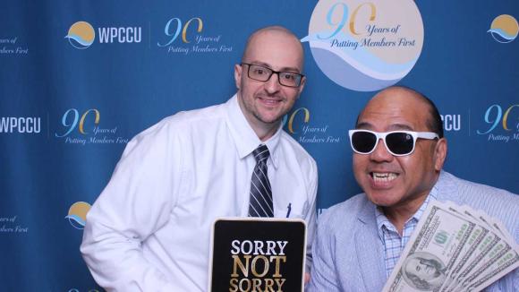 People taking a picture in a photobooth