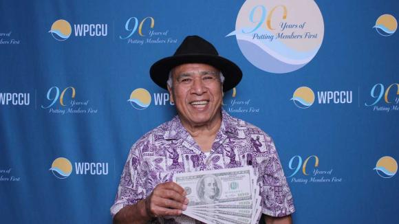 A person taking a picture in a photobooth