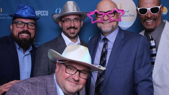 People taking a picture in a photobooth