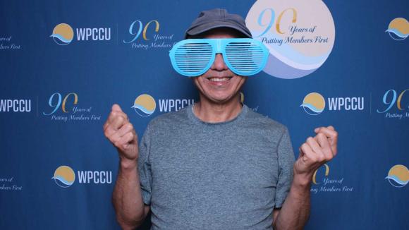 A person taking a picture in a photobooth