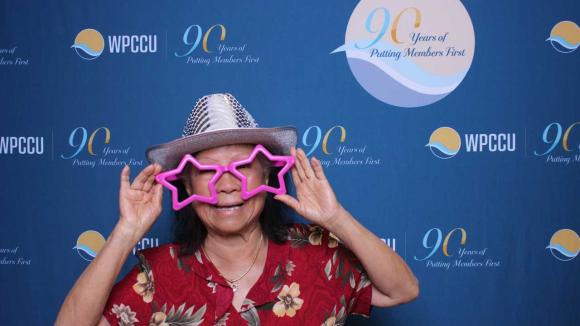 A person taking a picture in a photobooth