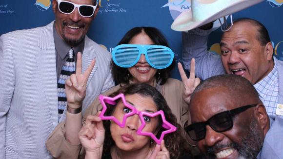 People taking a picture in a photobooth