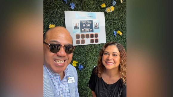 Two people posing for a photo