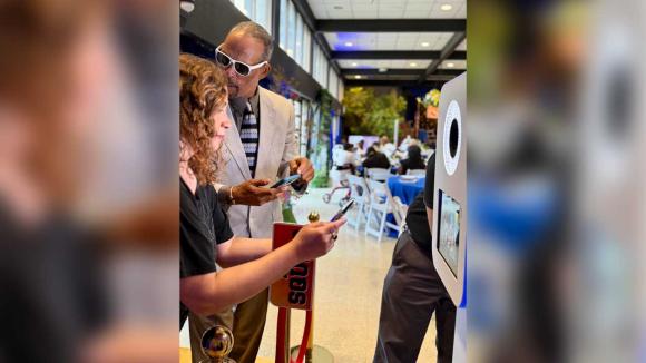 Two people taking pictures 