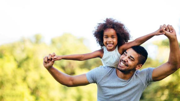 Father holding daughter 