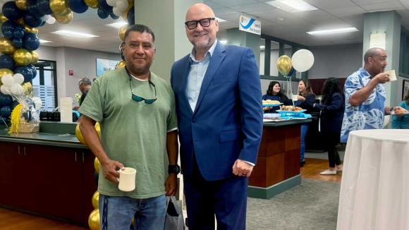 WPCCU's CEO and a member posing for a photo