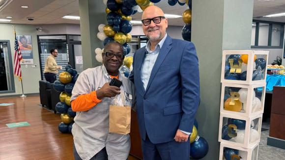 WPCCU's CEO and a member posing for a photo