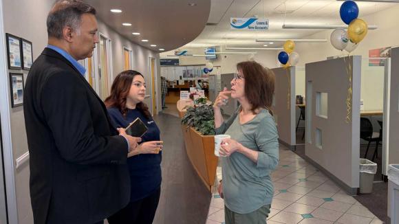 WPCCU staff talking to a member