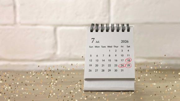 A calendar surrounded by confetti