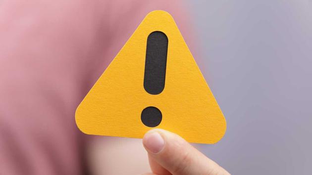 A yellow warning sign with an exclamation poin