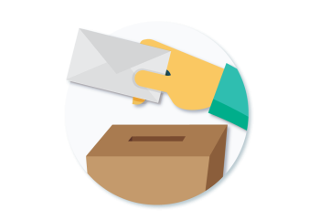 A hand holding a ballot. 