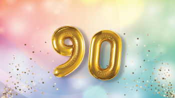 Two balloons, one in the shape of a "9" and another in the shape of a "0".