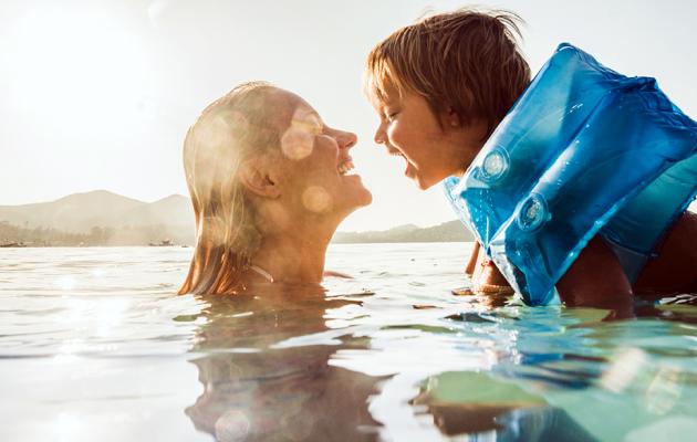 Woman and child swimming