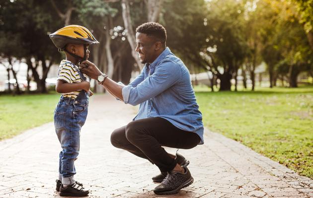 Man and child in park