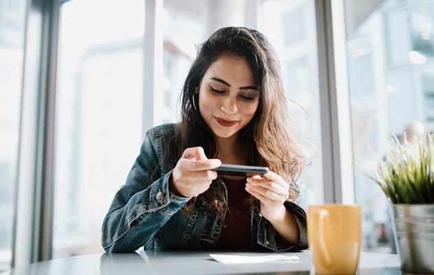 A woman looking at her mobile phone.