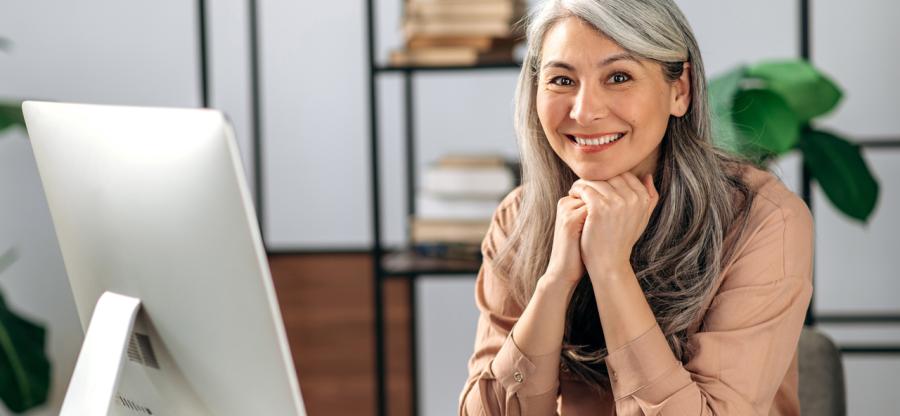 A woman sitting at her desk.