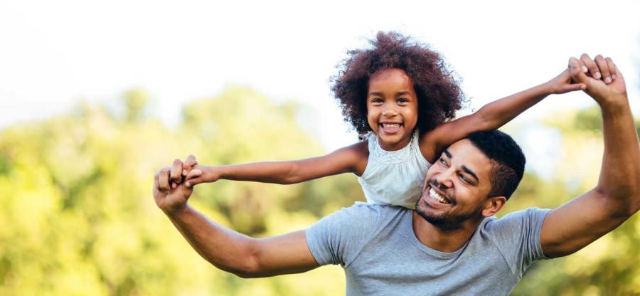 Father holding daughter 