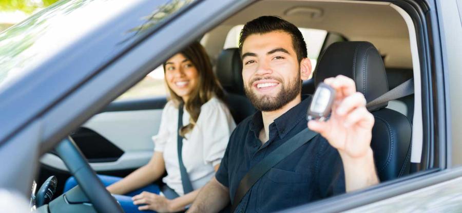 Two people in a new car