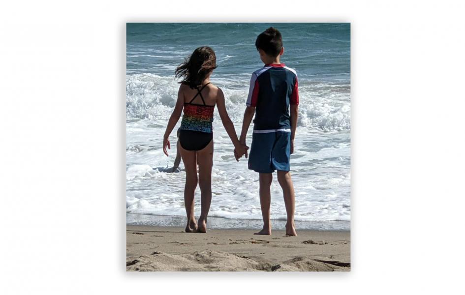 A photo of two kids at the beach.