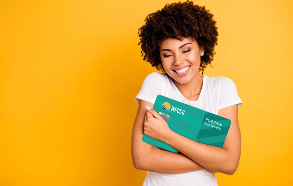 A young lady hugging WPCCU Mastercard