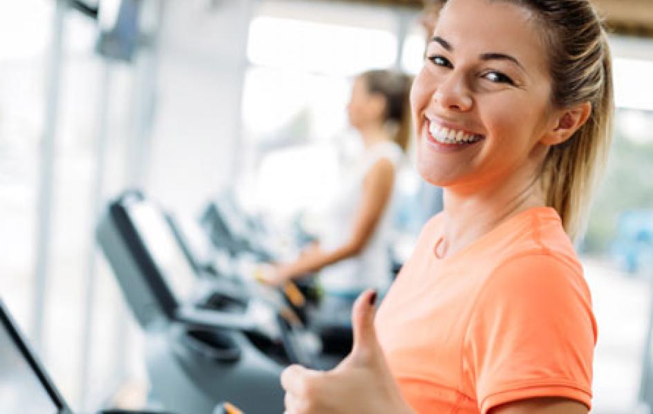 Happy Woman on treadmill.
