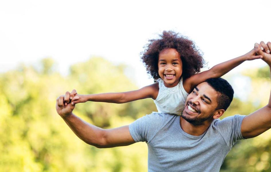 Father holding daughter 
