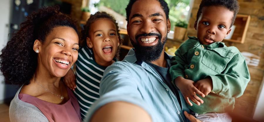 A family taking a selfie photo. 