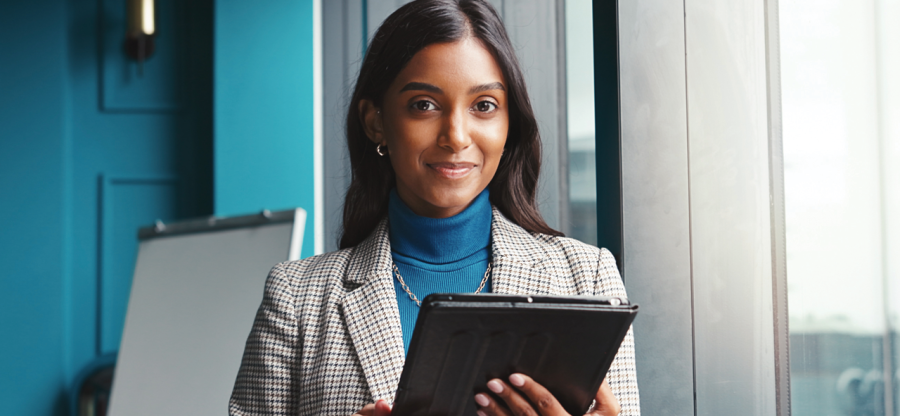 A person holding an electronic tablet