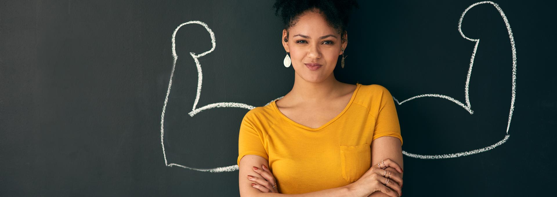 Women with chalk board behind her