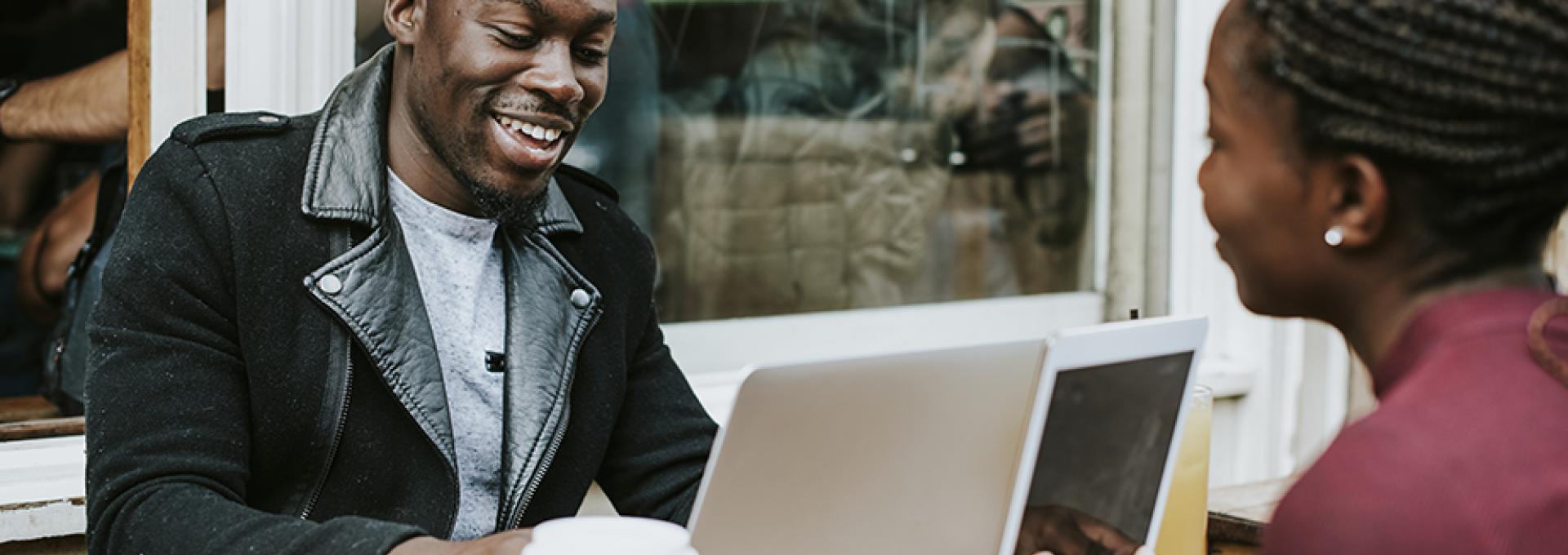 Couple with computer and coffee