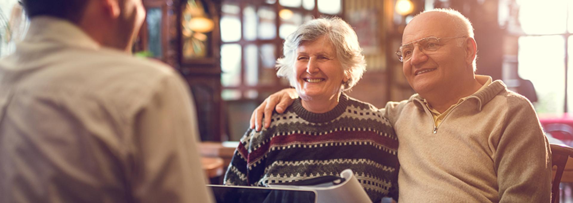 A couple talking to financial advisor