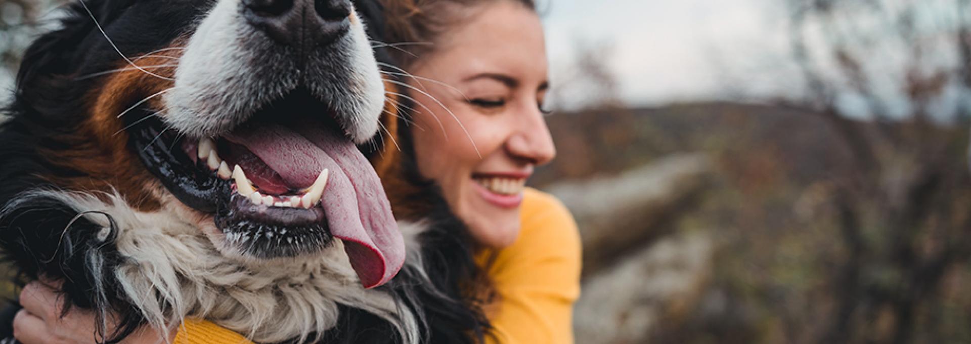 Woman hugging a dog