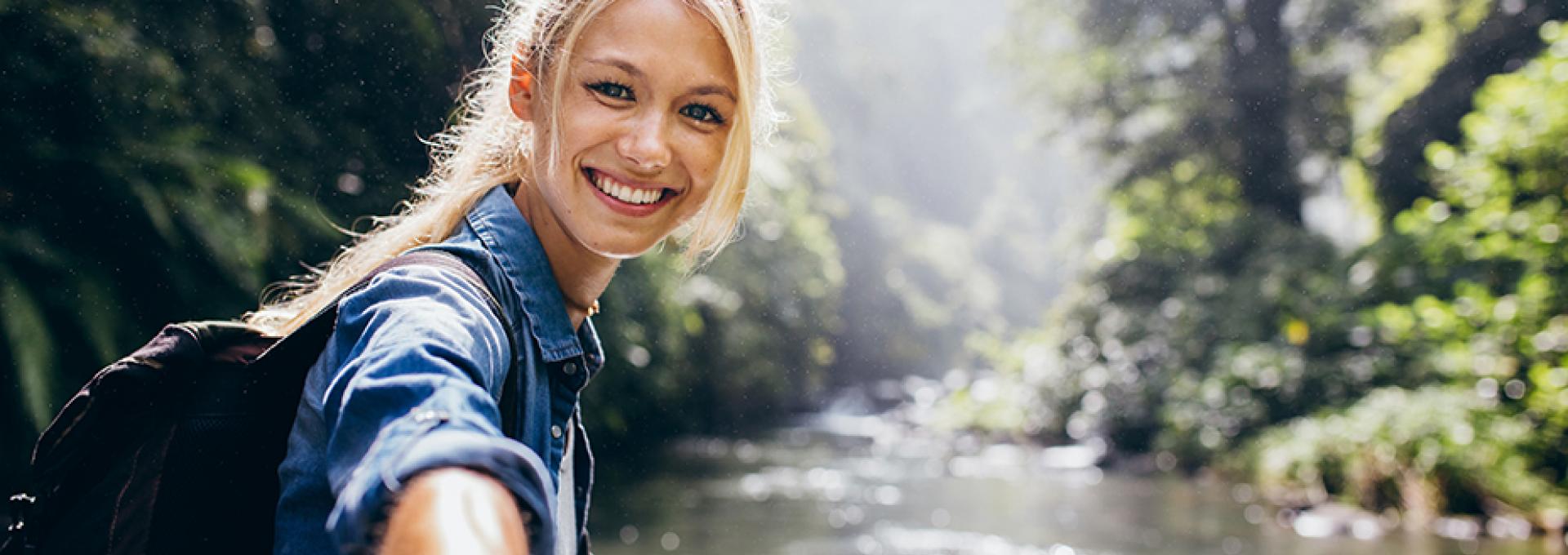 Woman next to a river