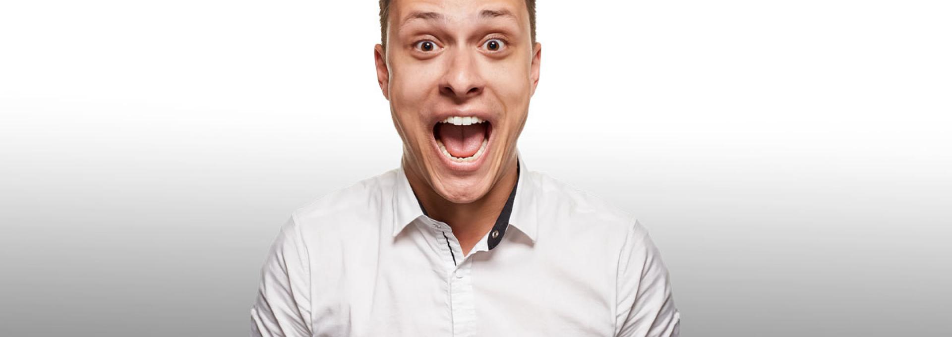 A man looking happy with his mouth opened