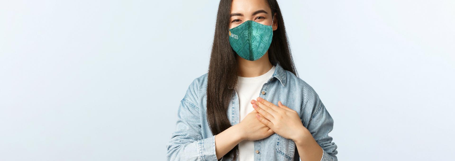 A young Asian-American woman with a face mask.