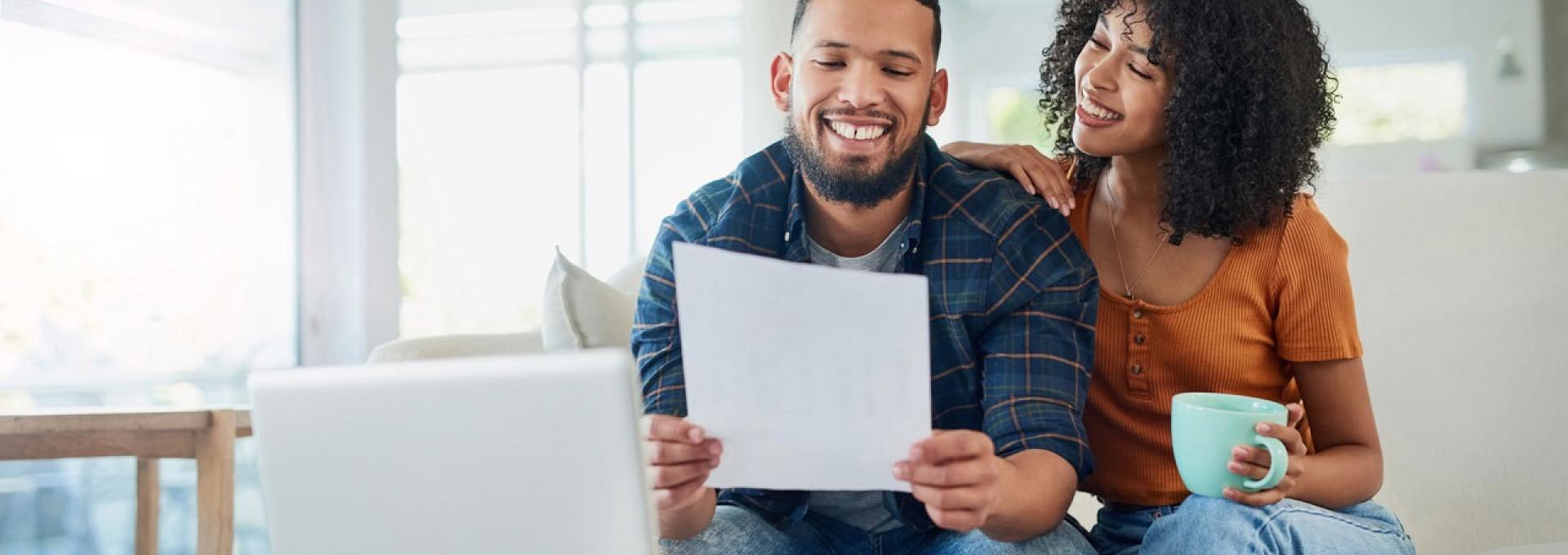 A photo of a couple that is looking at their financing options.