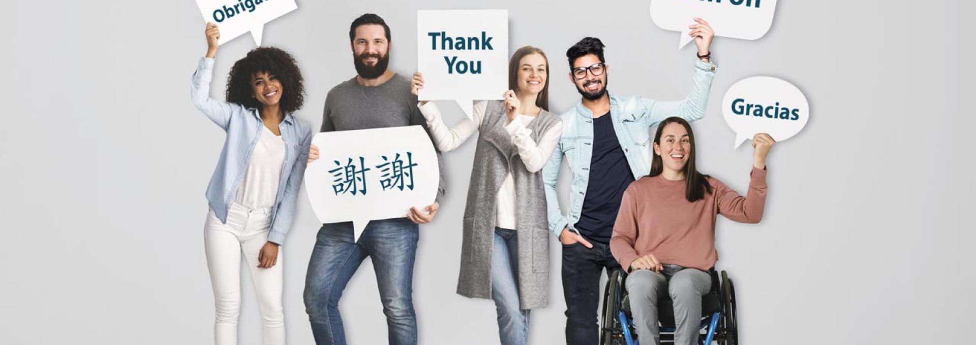 A diverse group of people holding up signs that read "Thank you".