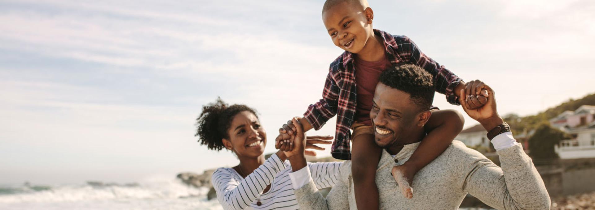 A family enjoying their time at the beach