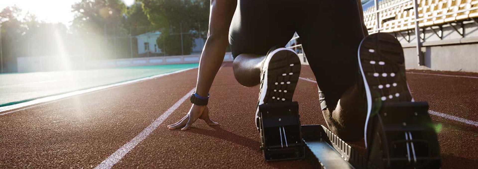 A runner is getting ready to start running.